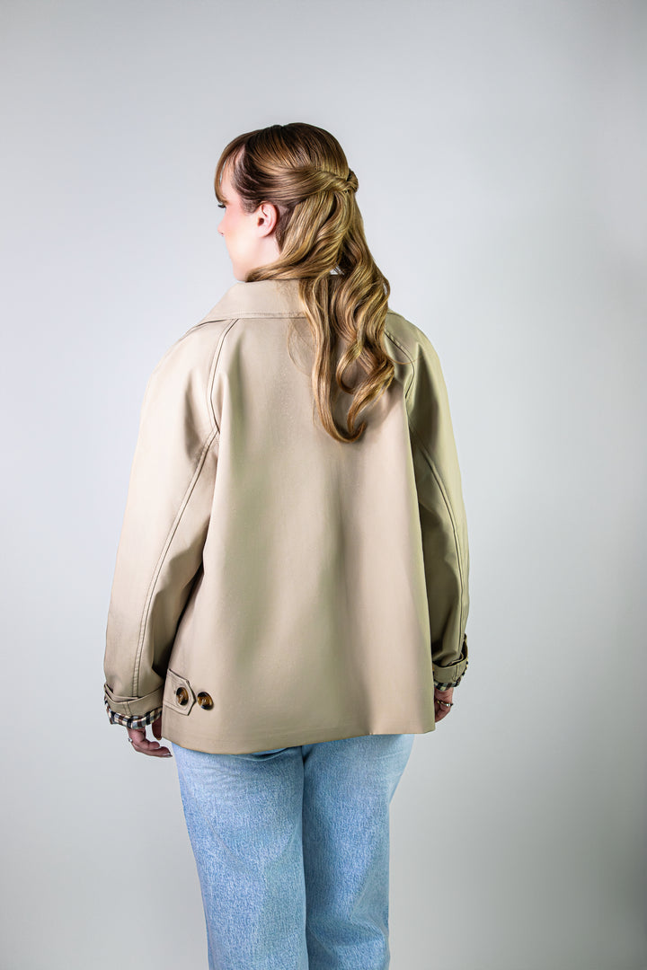 Veste élégante en beige avec doublure à carreaux